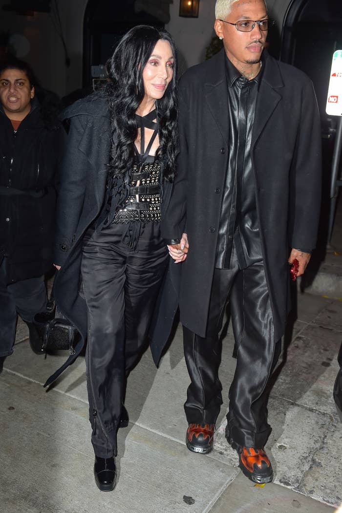 cher and AE holding hands