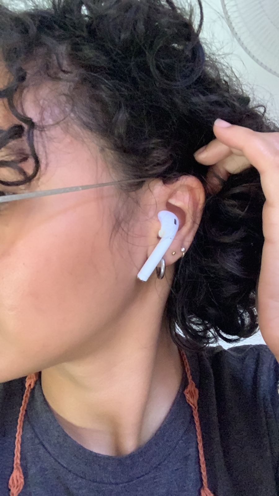 A reviewer with the airpod in their ear