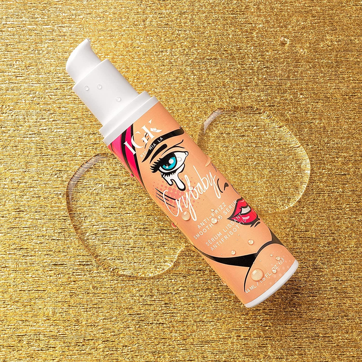 The bottle of serum on a swatch of product
