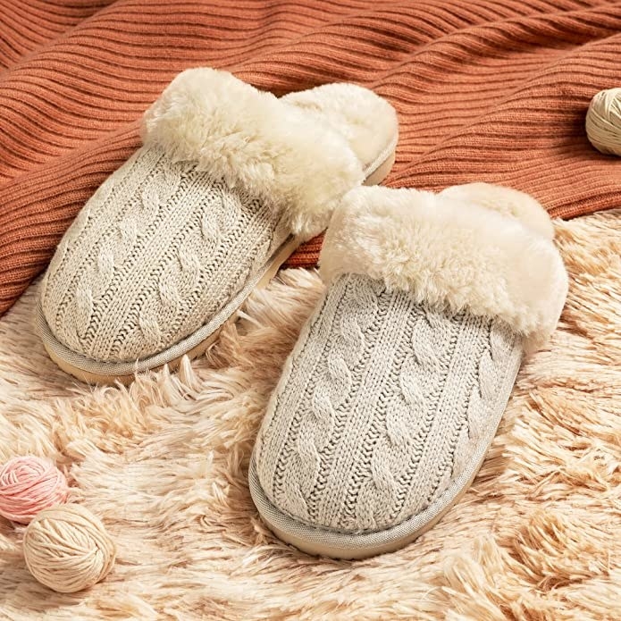 The slippers on a faux fur blanket
