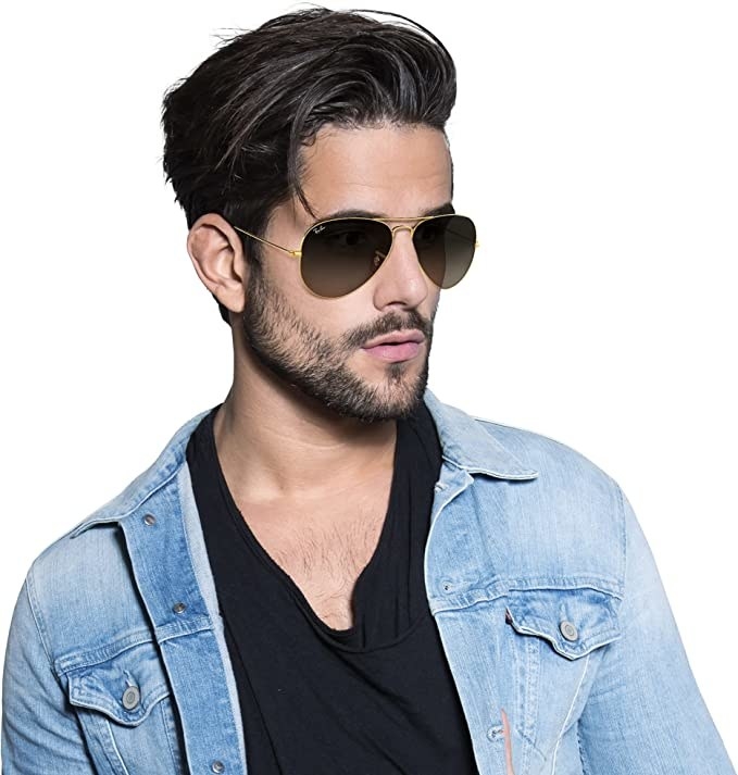 a person wearing the sunglasses against a plain background