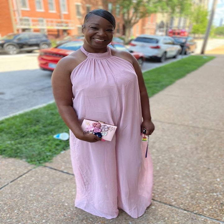 Image of reviewer wearing pink jumpsuit