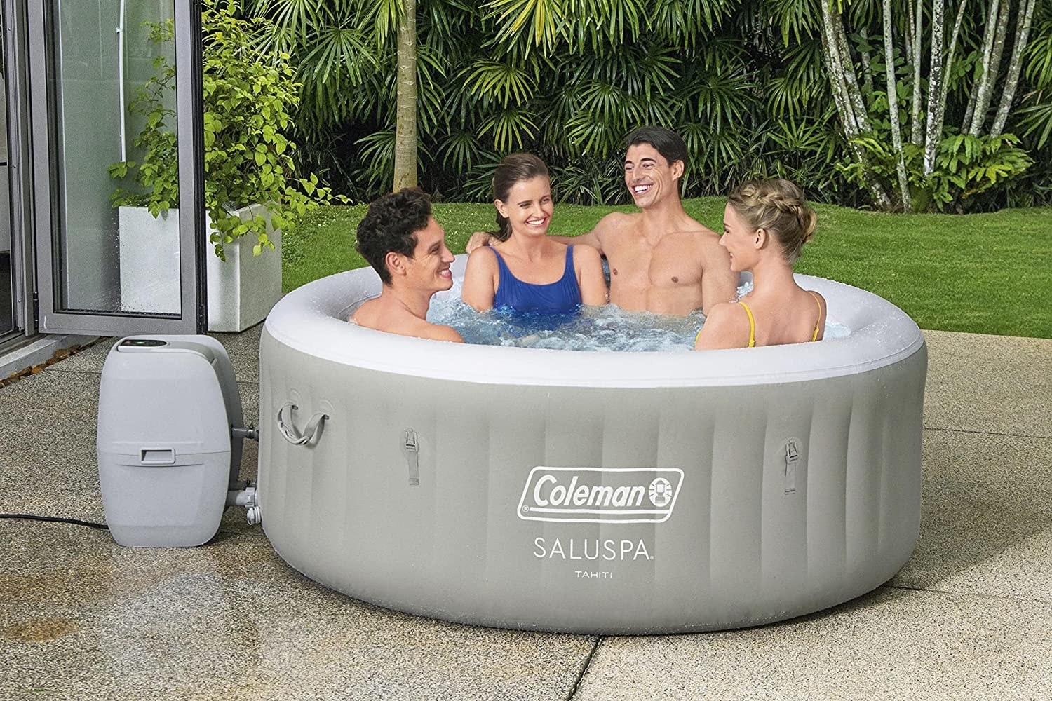 Four models sitting in outdoor inflatable hot tub