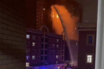 Fire spreads in an apartment building in Xinjiang, China.