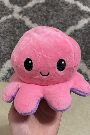 the pink smiling side of an octopus