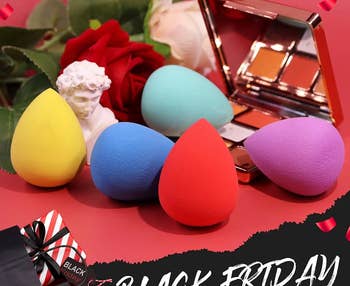 Five tear-drop shaped makeup sponges in different sizes and colors