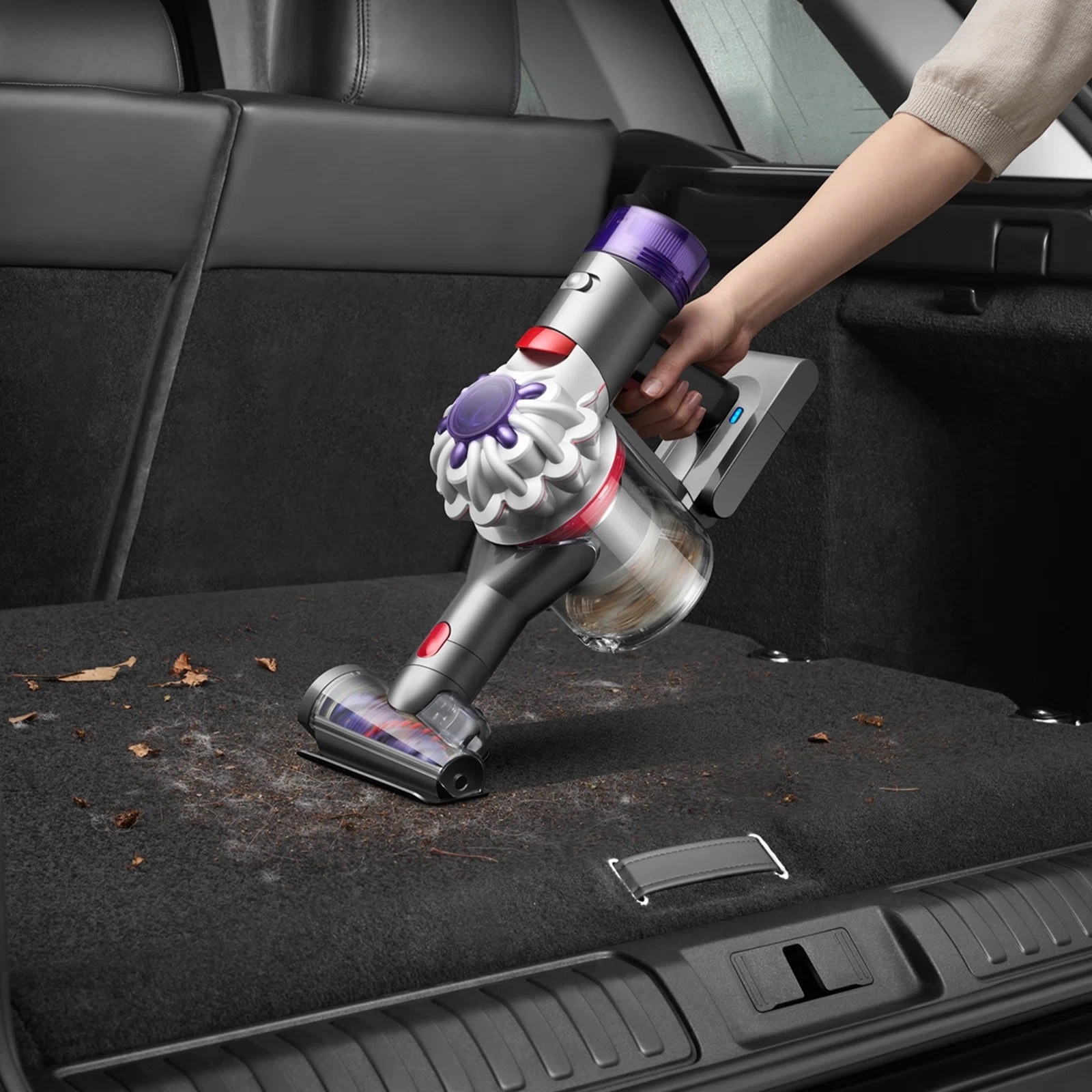A model using a vacuum in a car