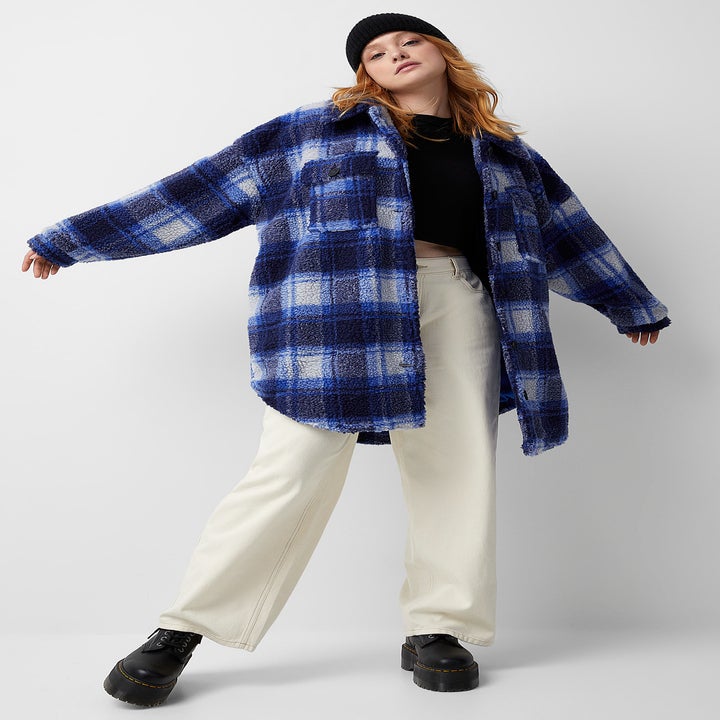 A person wearing the jacket with pants and Docs