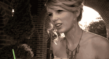 GIF of Taylor drinking from a straw