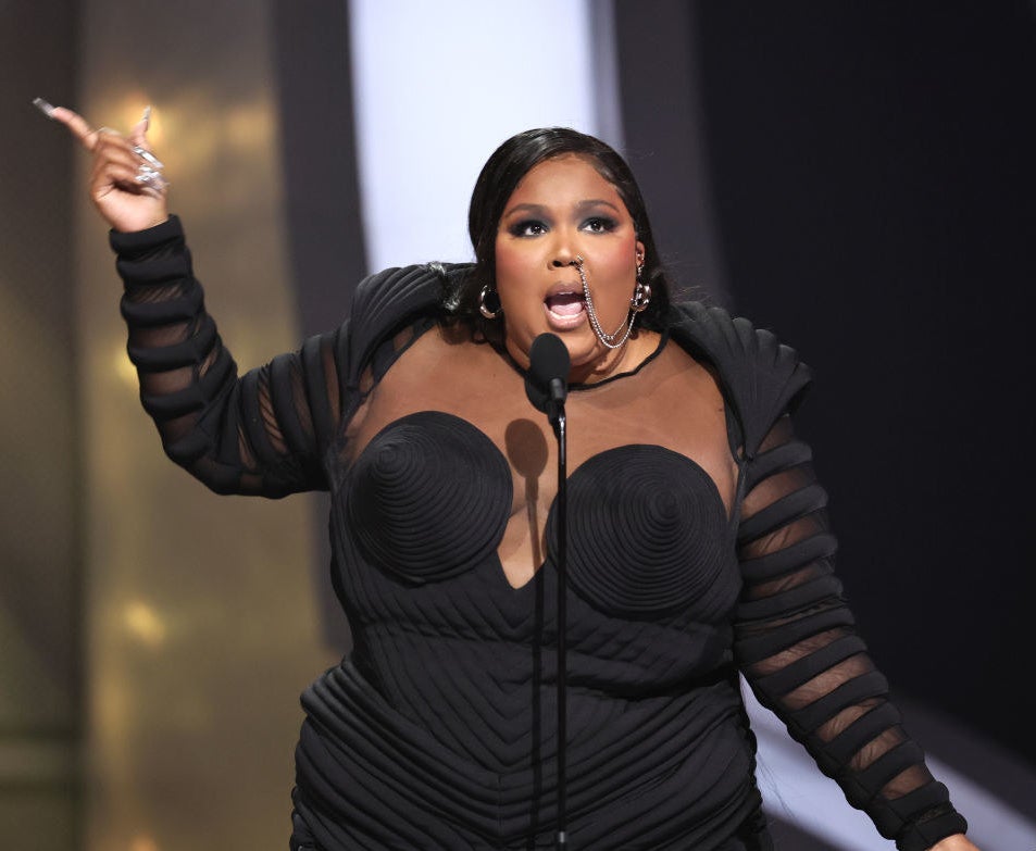 Lizzo at a microphone