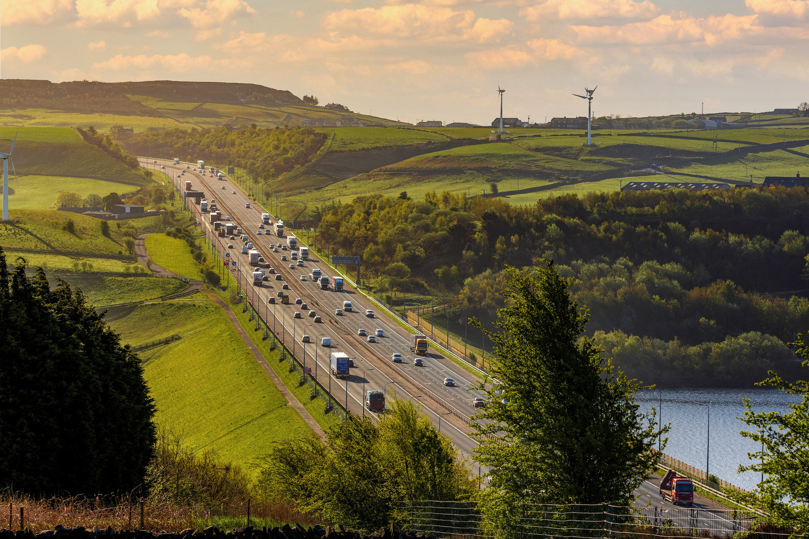 View of the M62 motorway, with fields and trees surrounding it