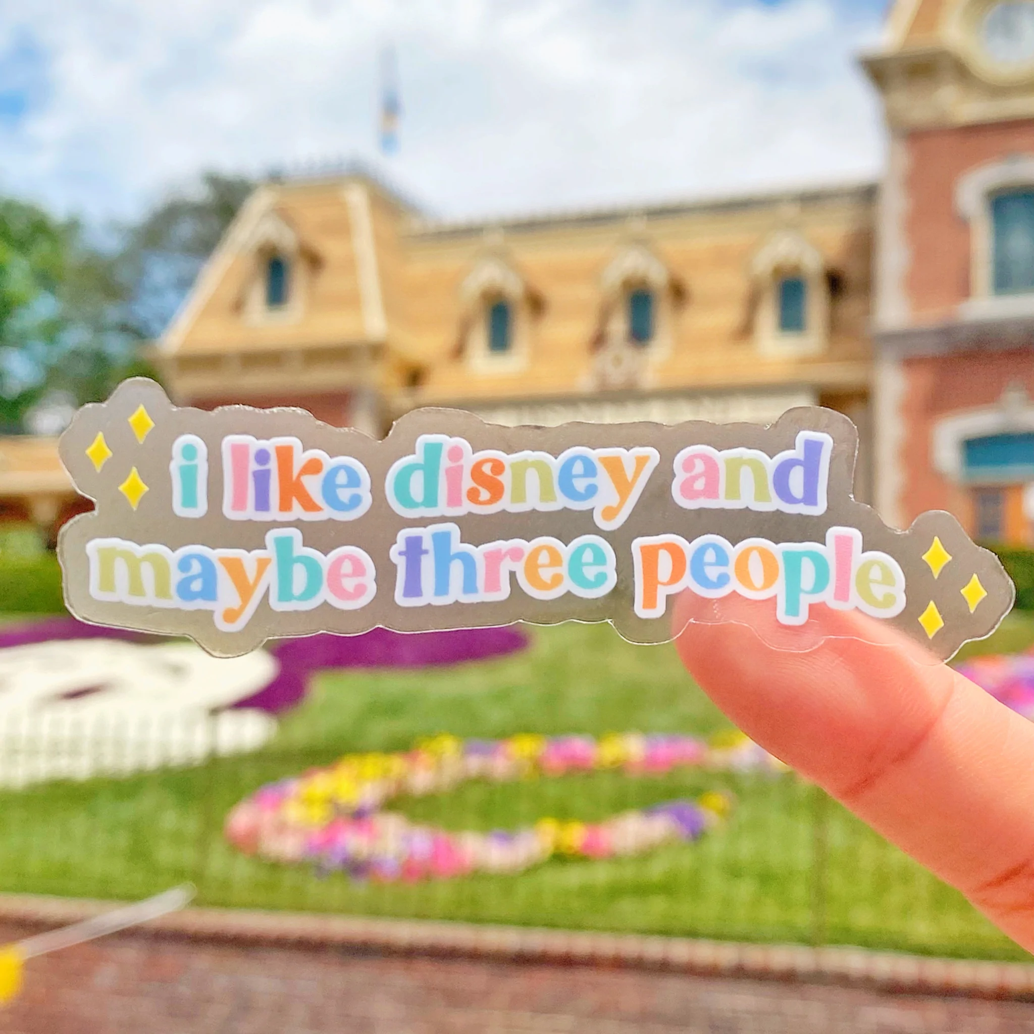 a colorful sticker that says &quot;i like disney and maybe three people&quot;