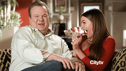 cameron and gloria from modern family dancing happily