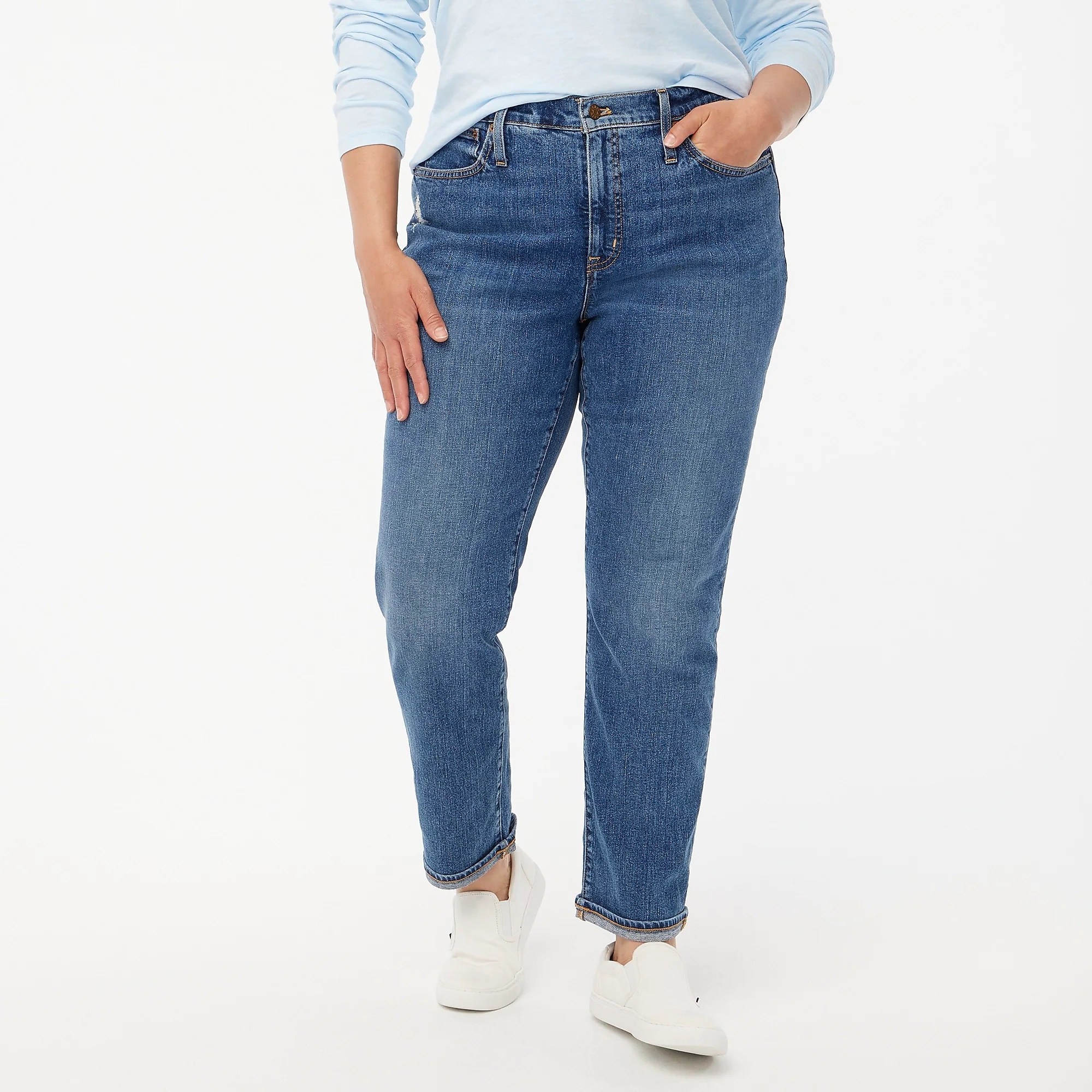 model in straight leg medium wash boyfriend jeans