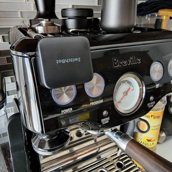 The black version on a coffee machine button