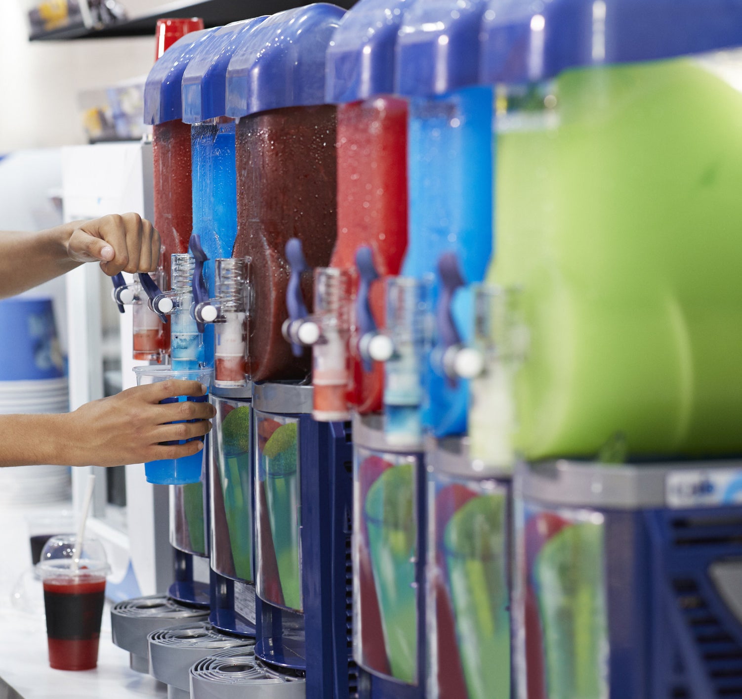Machines full of colorful soft drinks