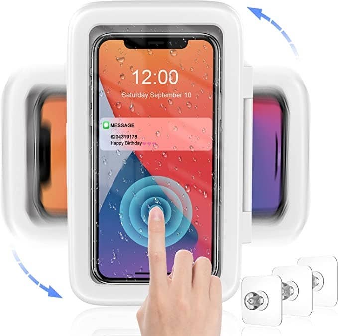 A picture of a person tapping their phone through the holder