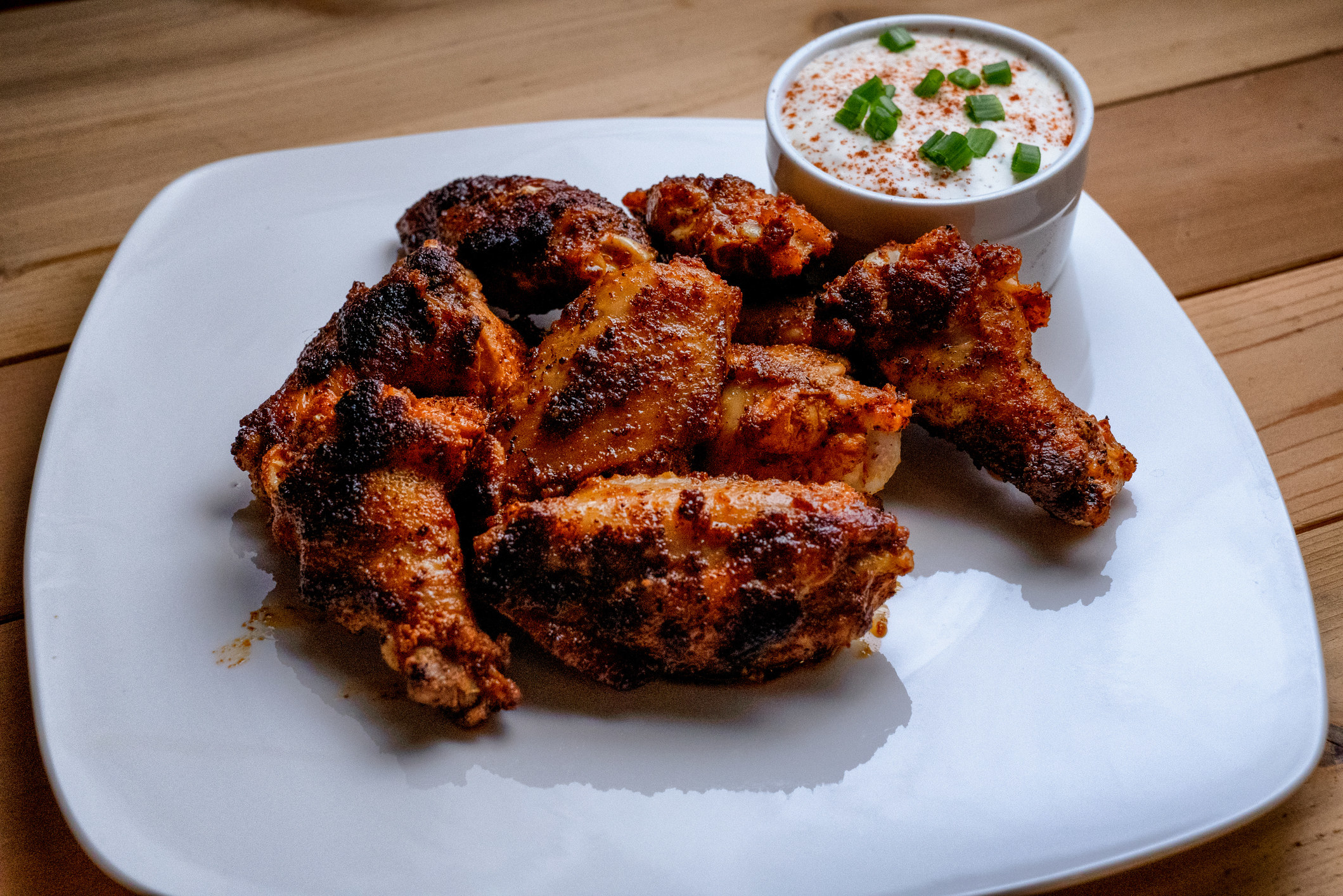 Plate of Buffalo chicken wings with ranch dressing