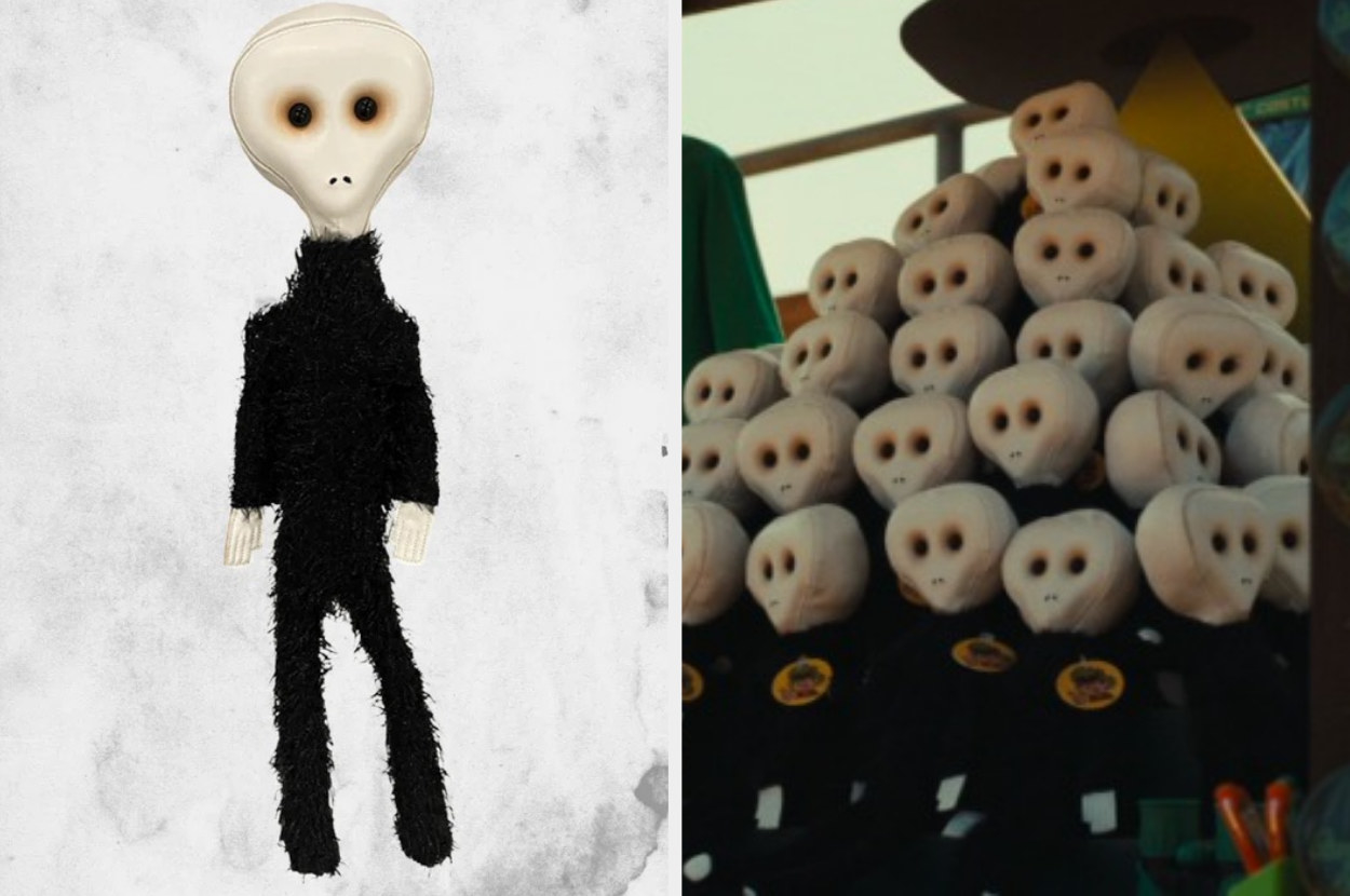A tall skinny alien doll with a fuzzy body and a hard egg shaped head