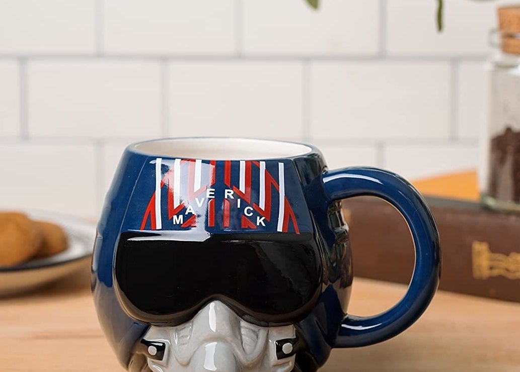 A mug with a 3D design that has the mask and goggles for Maverick