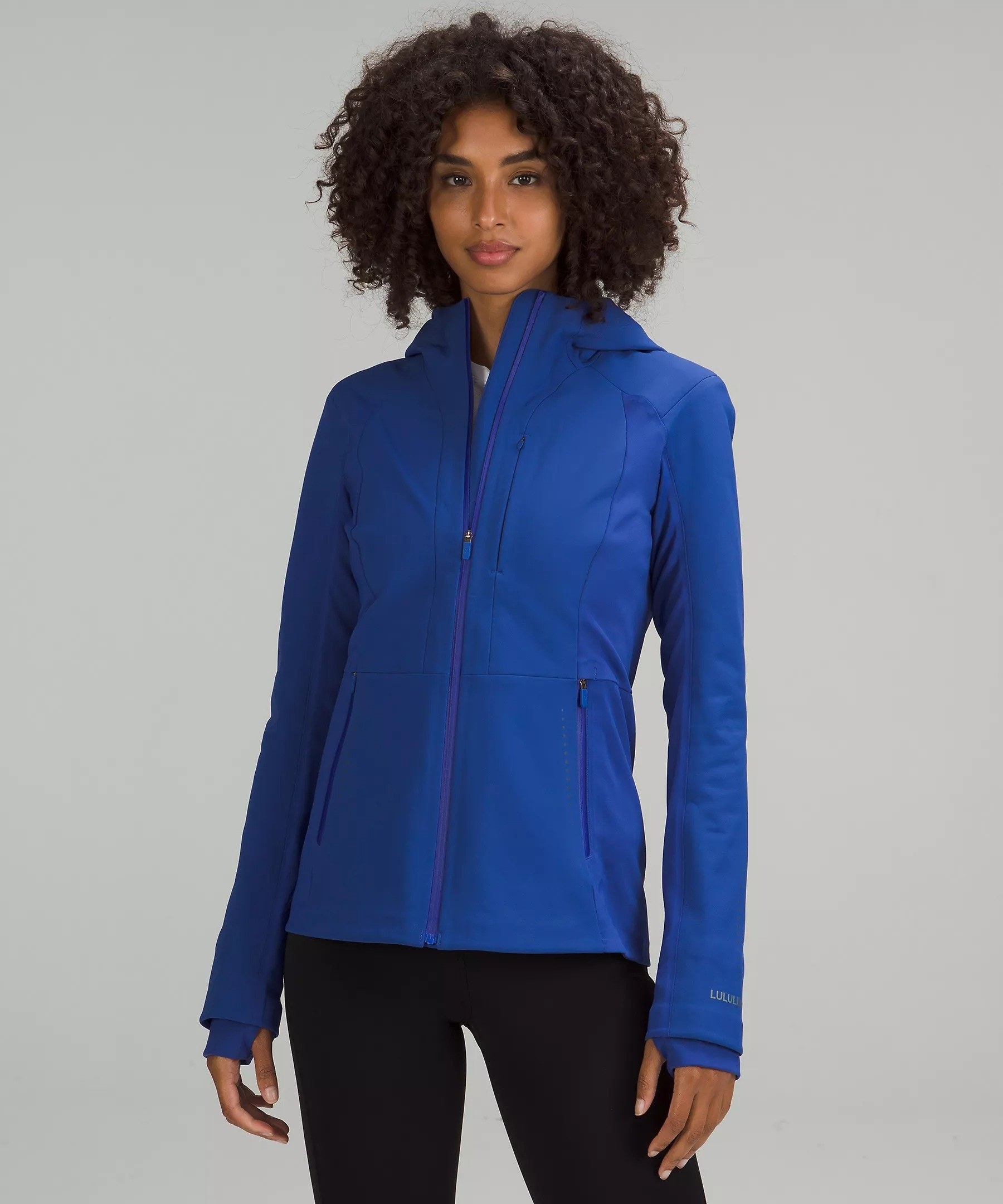 a model wearing the jacket in blue