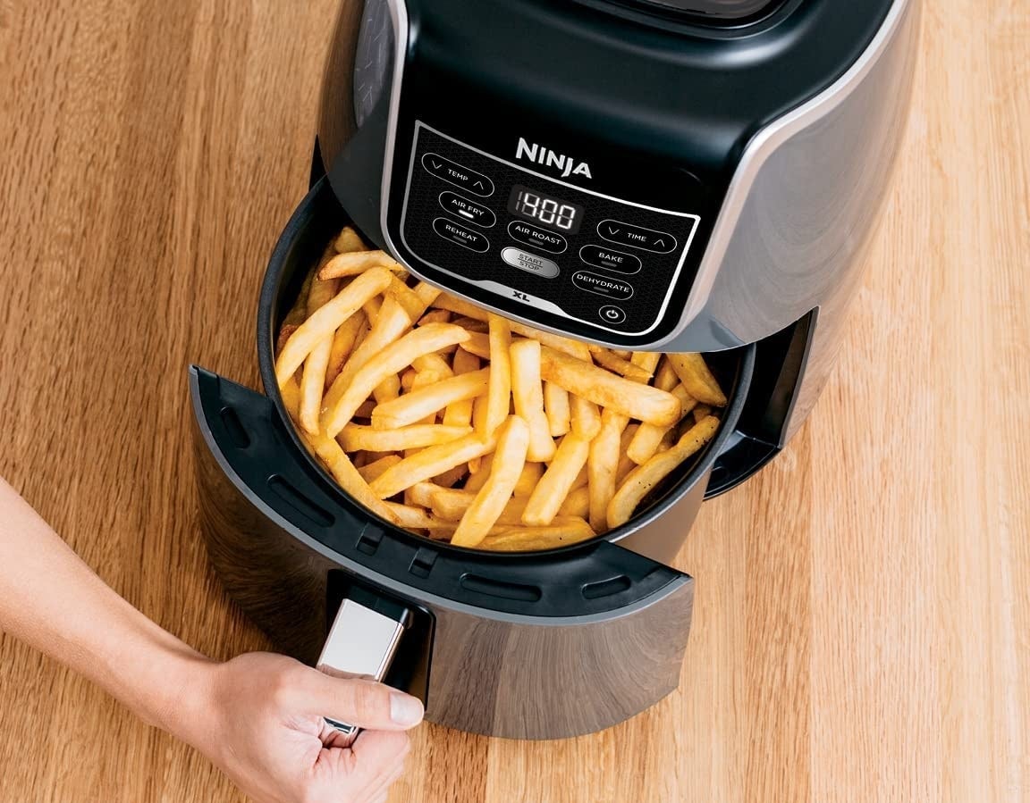 french fries being cooked in the air fryer