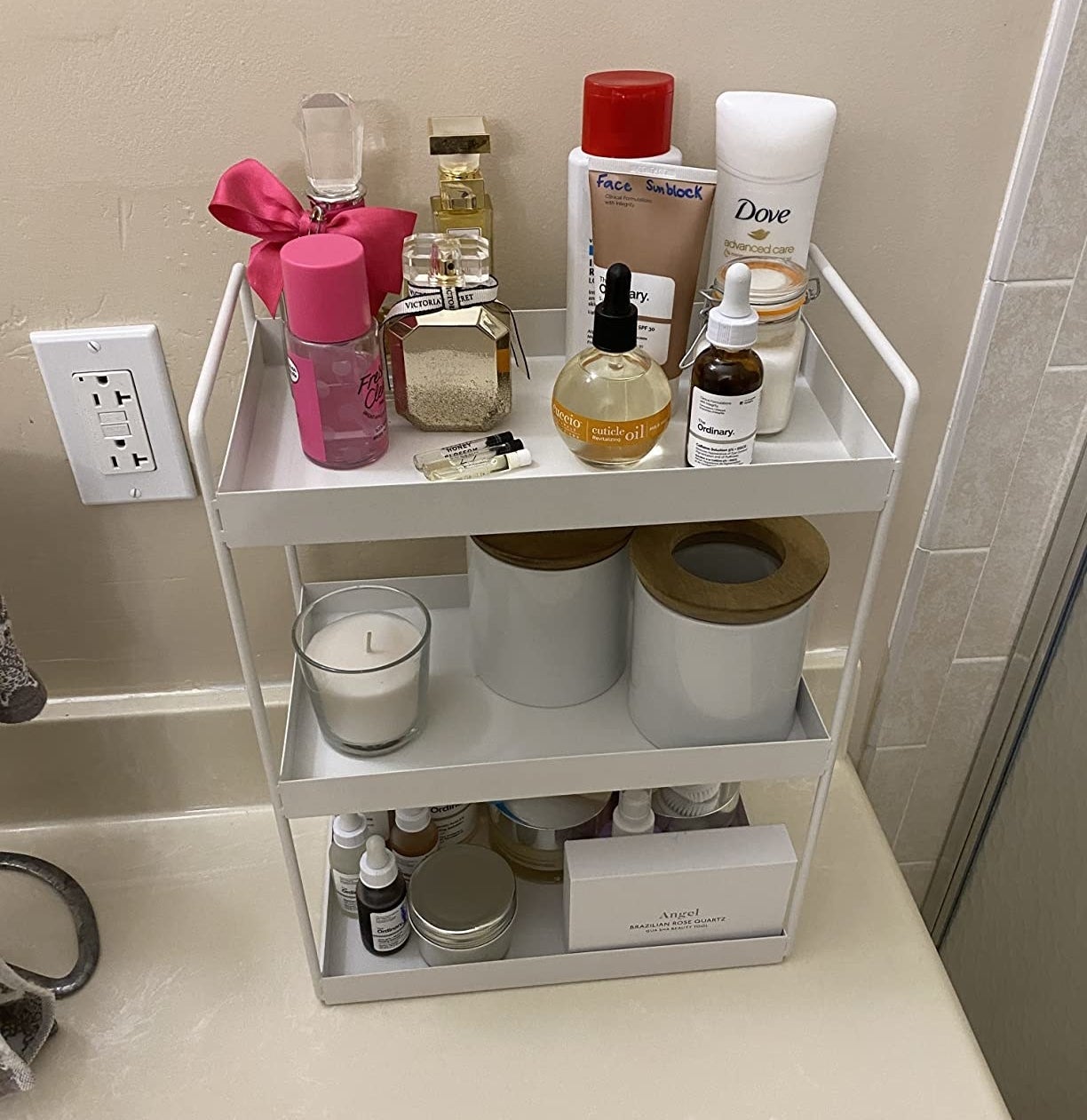 a reviewer&#x27;s shelf in their bathroom