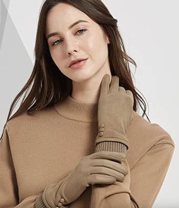 a model wearing the beige gloves