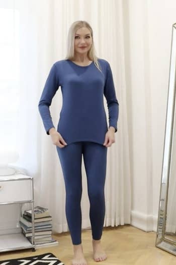 a model wearing the blue thermal set