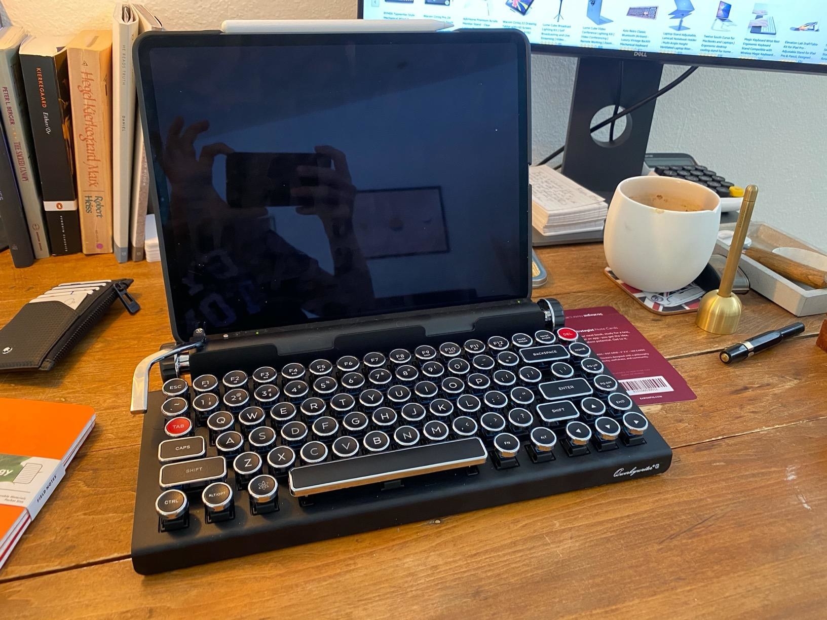 a reviewer&#x27;s keyboard paired with a tablet