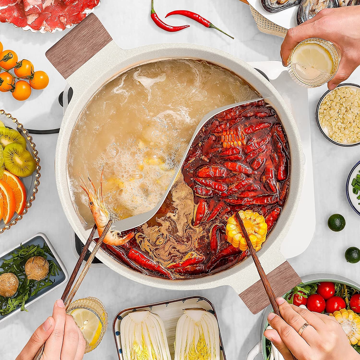 Two people dipping food into a boiling hot pot
