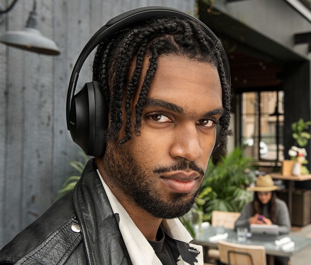 A picture of a man wearing a pair of black headphones