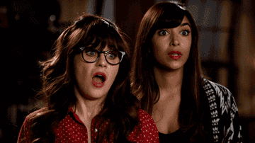 jess and cece from new girl looking surprised and uncomfortable