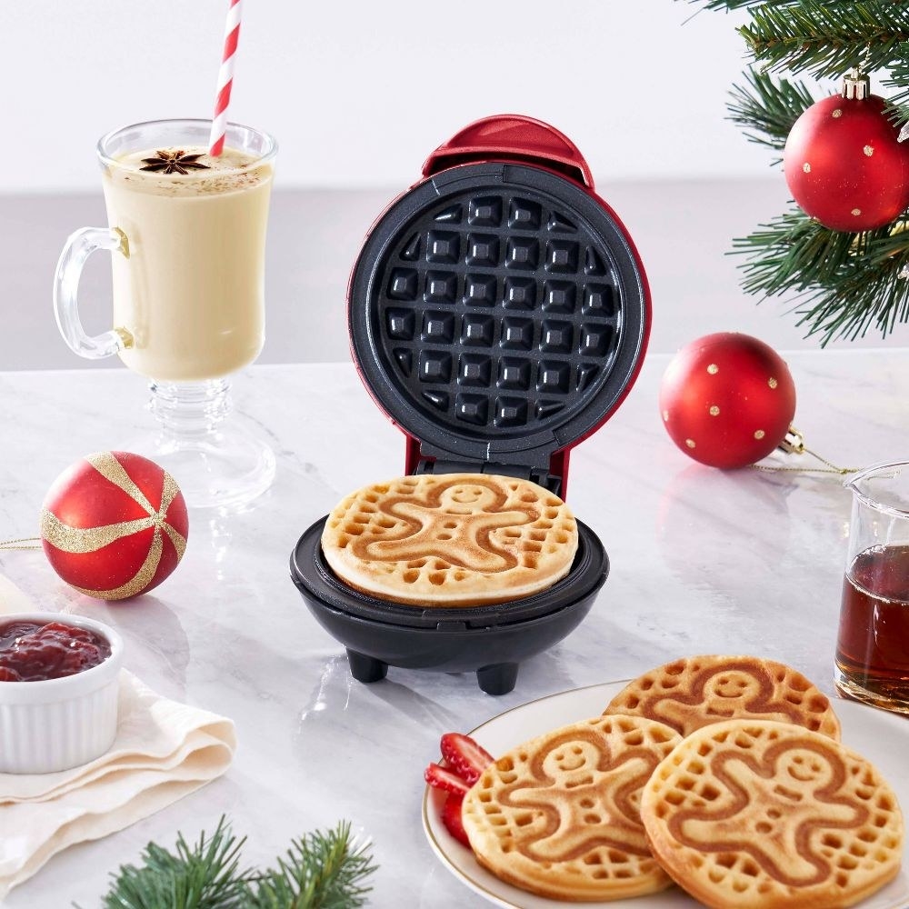 the waffle maker and stack of waffles