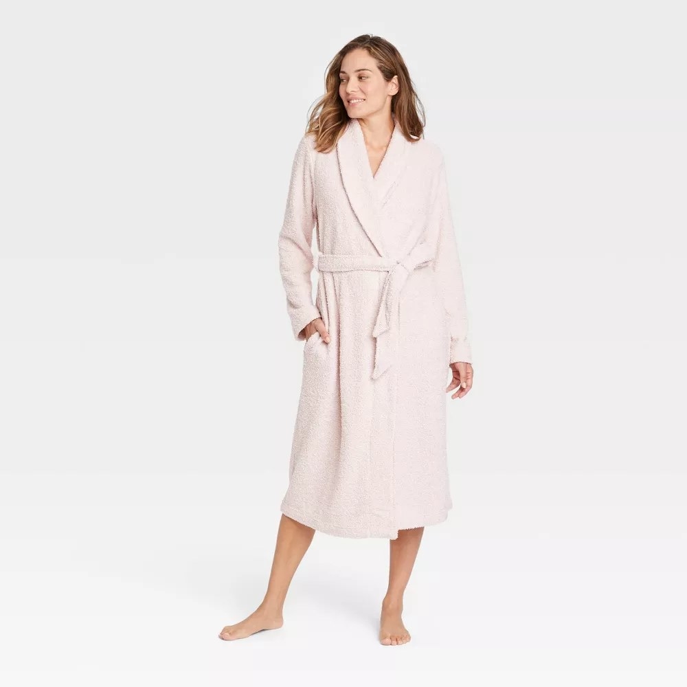 A model wearing the robe in the color Pink
