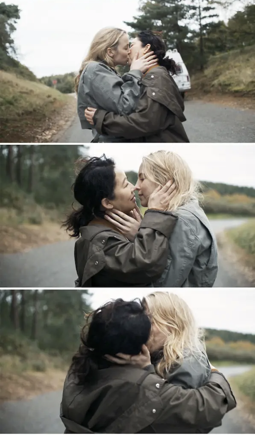 Villanelle and Eva sharing a kiss in the middle of the road