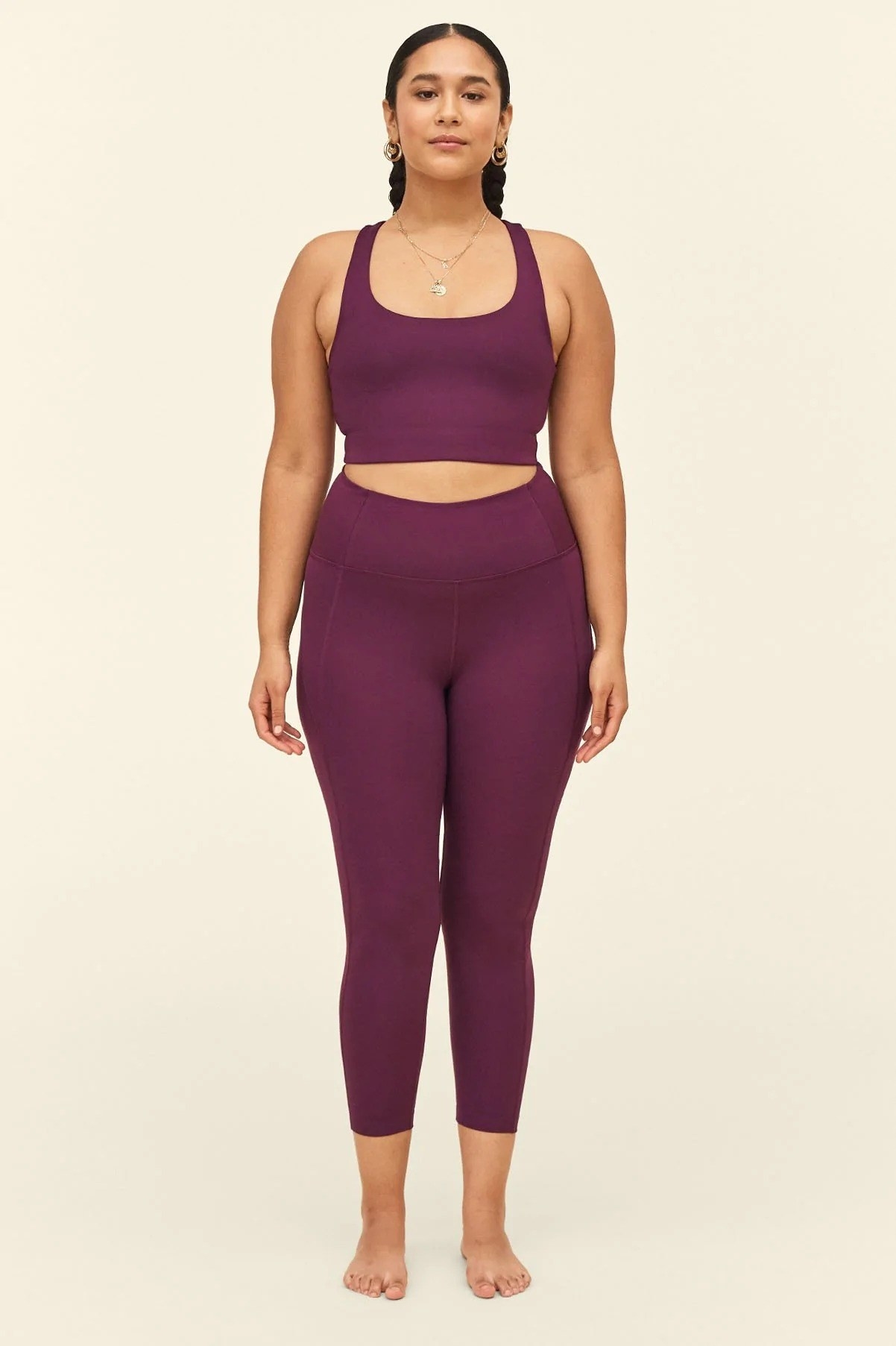 model wearing the high-waist stretch leggings in a purple color