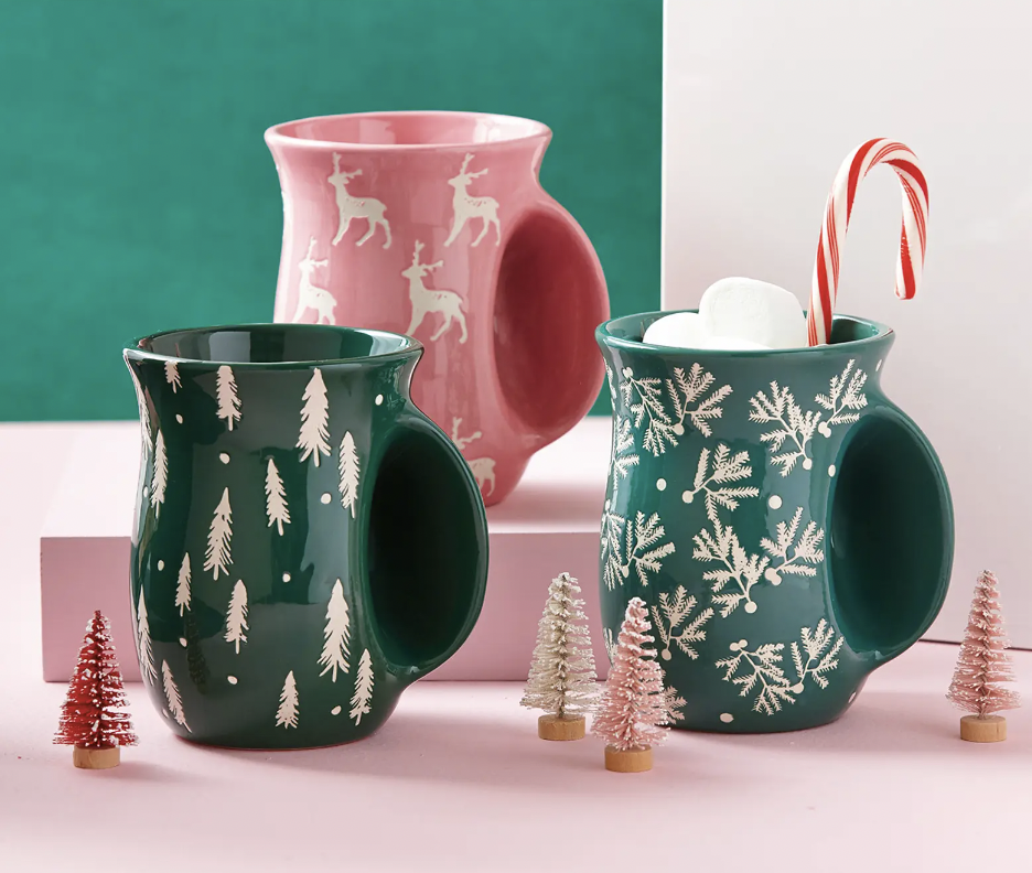 a trio of hand-warming mugs in a festive setting