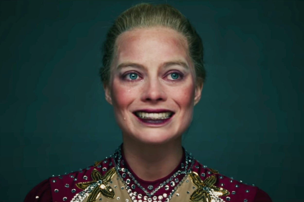 Margot Robbie smiling while crying as Tonya in I, Tonya