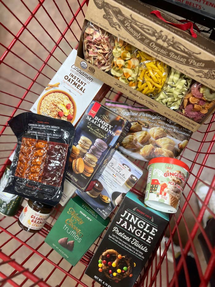 A grocery cart filled with food.