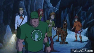 John Cena interacts with Scooby Doo and the Gang on a mountainside