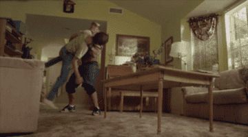 John Cena throws Fred through a wooden table