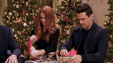 People unwrapping presents