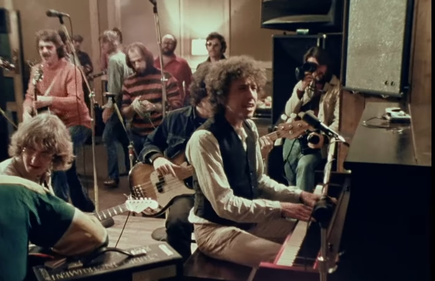 Bob Dylan plays at a piano