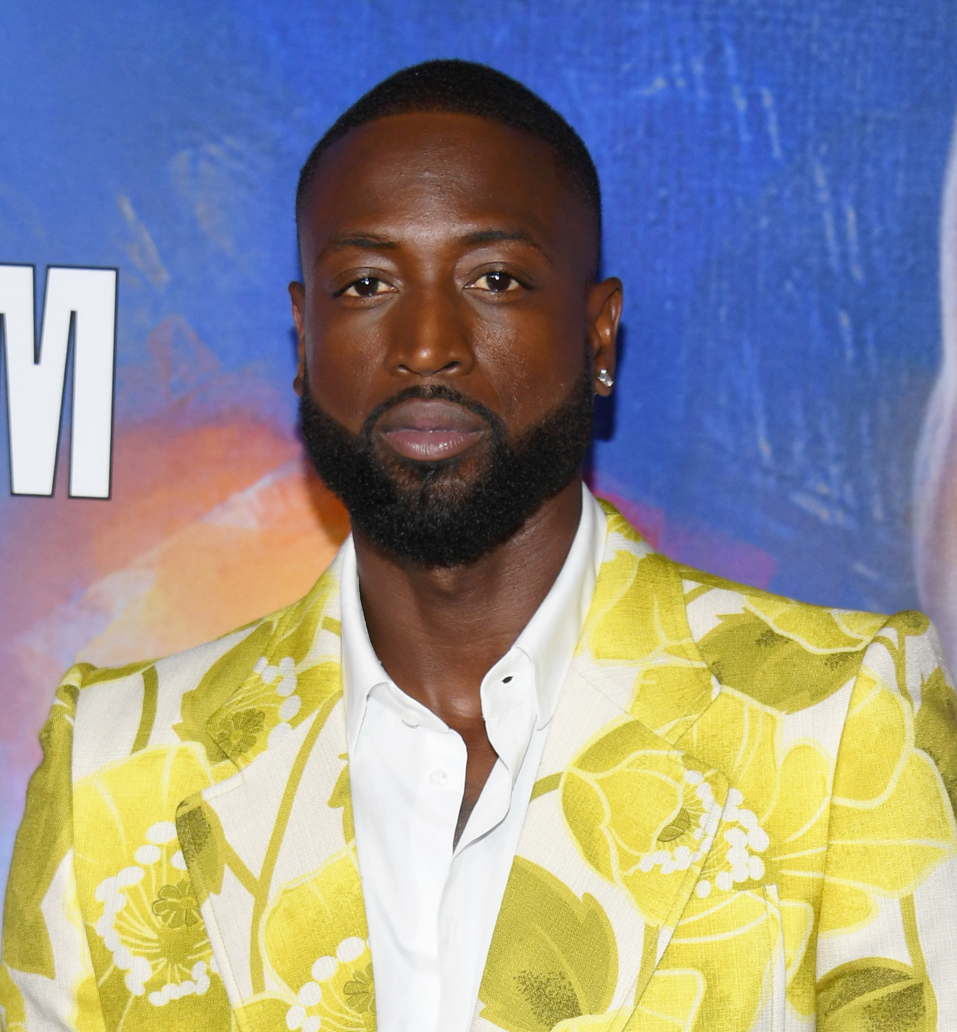 Close-up of Dwyane in a floral-print jacket