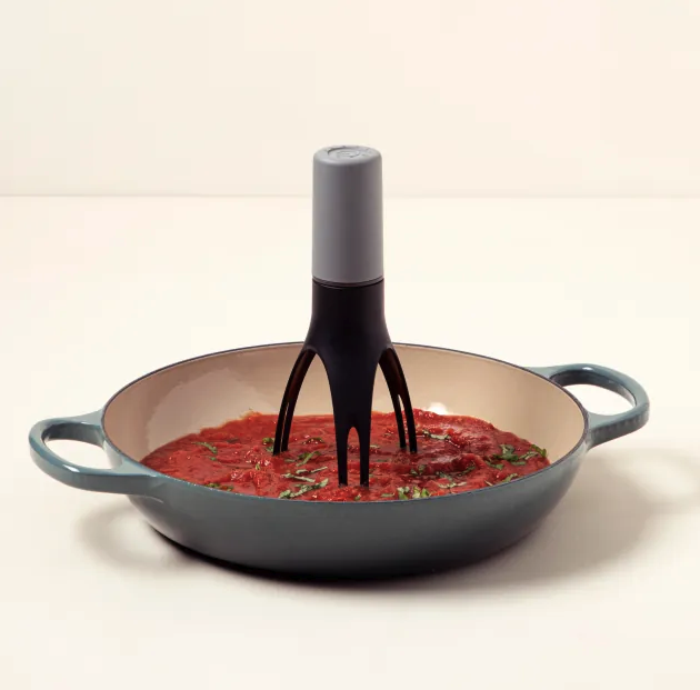 the automatic stirrer in a pan of sauce