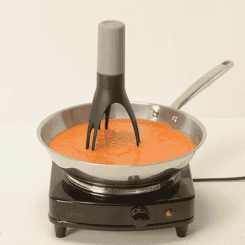 Gif of the pan stirrer in motion stirring a sauce in a pan
