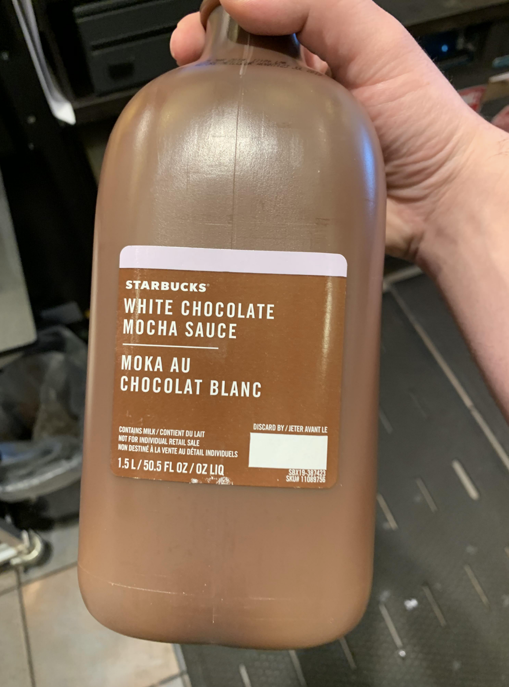 A white chocolate mocha sauce that is in a brown bottle, making it indistinguishable from the regular chocolate bottle