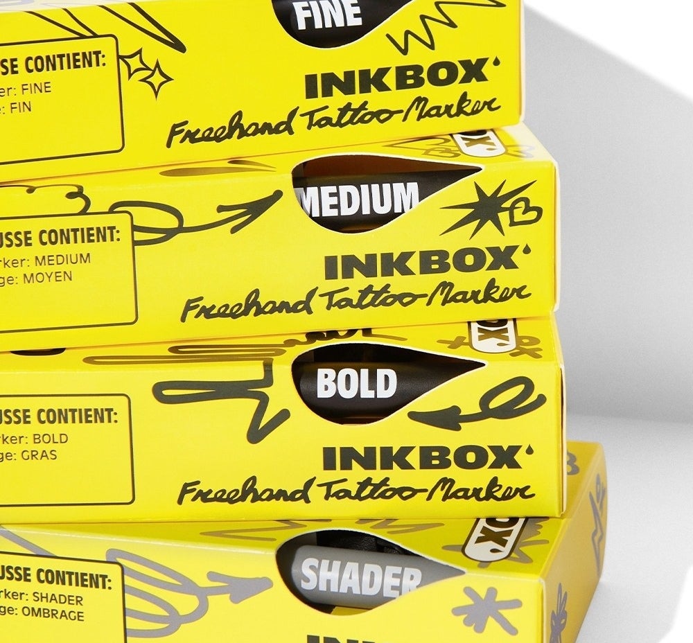 different sizes of the tattoo markers in their boxes on top of each other