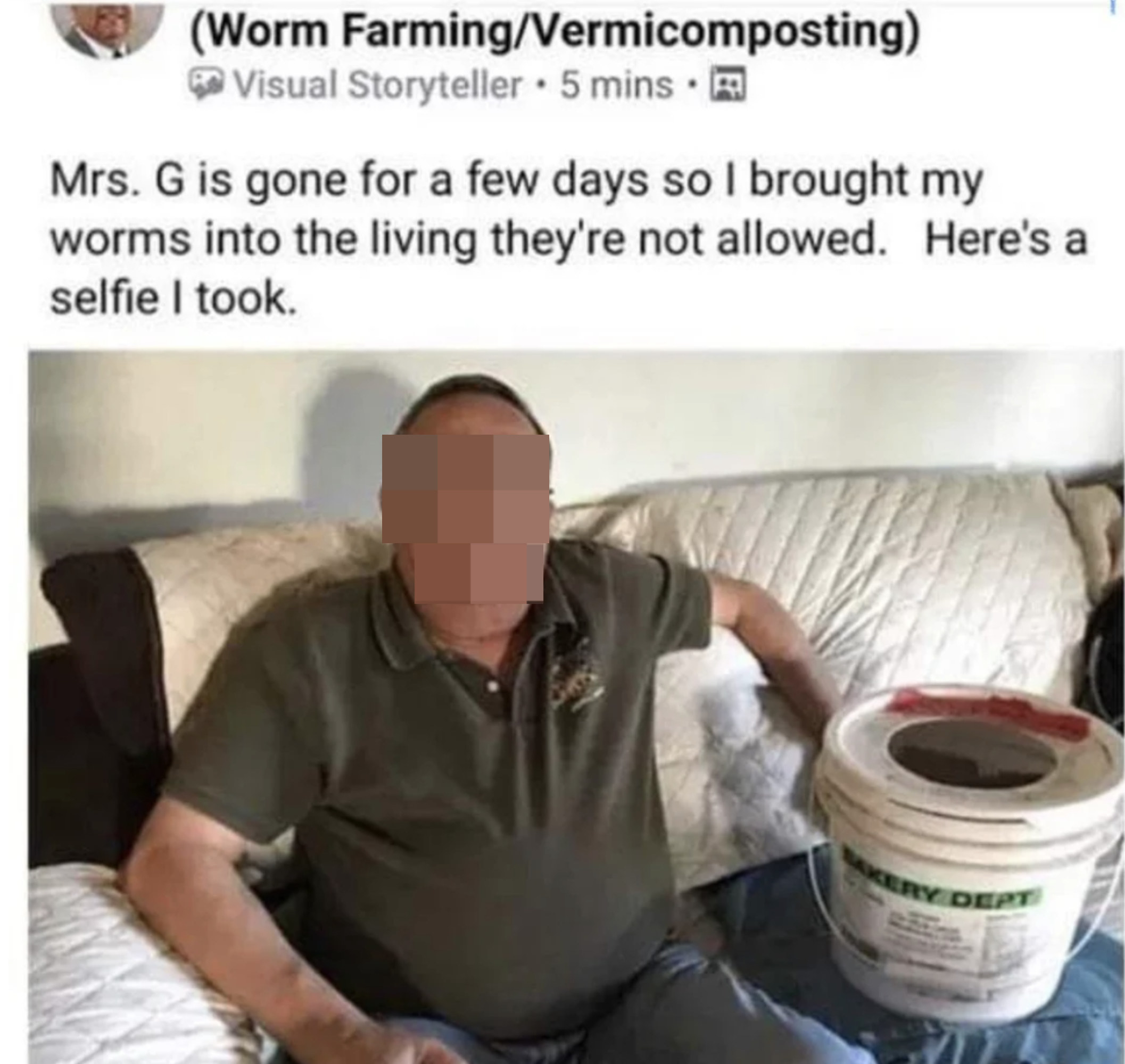 man sitting on a couch next to a large bucket